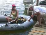 dinghying from dock to boats on mooring line