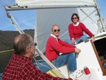 all on leeward side of the boat to fill sails, wind falling off..