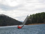 standard heeling picture of pretty red boat racing..