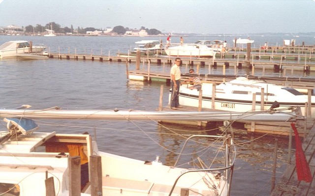 Rigging the boats at Norfolk, Bob and Jane Waterfield with Camelot..