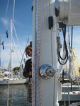 Minta Fannon playing peak-a-boo behind mast of Hylas 70