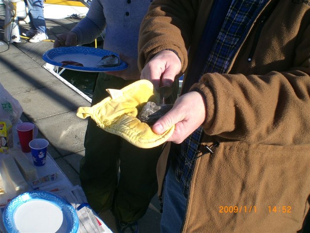 carefully opening oyster..