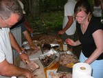 Julia (Murdoch's daughter) chopping up the pig!