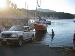 Windward collides with log on lake and taking on water up the creek..
Clarke Lucas arranged impromptu extraction!