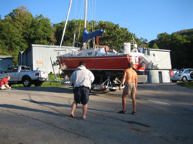 Jeff and Sam watching as Thurman pulls Windard out of lake