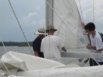 Bill Murdoch repairing blown-out sail for Matt Little