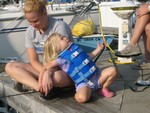 fishing before pancake breakfast Sunday morning on Lakeshore sailboat dock