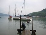 Boats on buoy line near portable dock