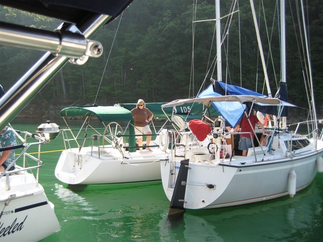 Circling to attach to buoy line in cove near dam
