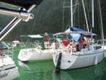 Circling to attach to buoy line in cove near dam