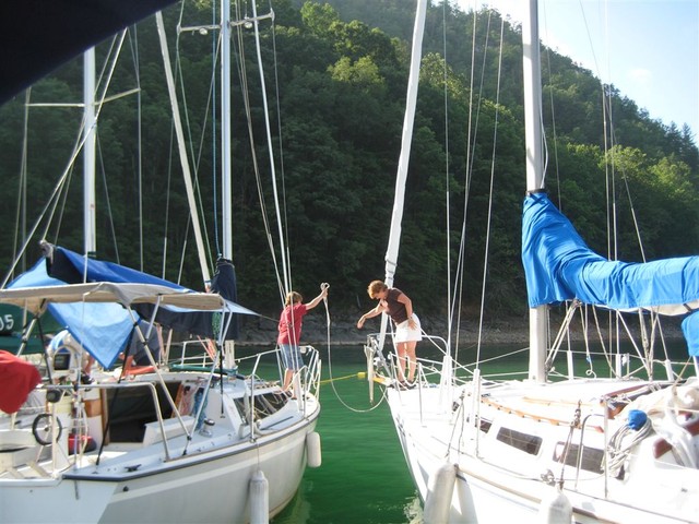 Circling to attach to buoy line in cove near dam