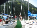 Circling to attach to buoy line in cove near dam
