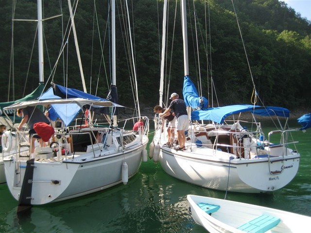 Circling to attach to buoy line in cove near dam