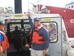 Ferry broken, Dave and James hitched a ride on Jersey City fireboat, they assumed we were sea paddlers..