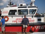Ferry broken, Dave and James hitched a ride on Jersey City fireboat, they assumed we were sea paddlers..