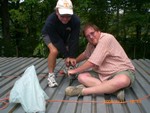 Sat July 21, 2008, screwing down the subdeck..
(Picture submitted by C. Lucas)