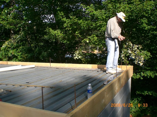 John M. checking the dimensions.

It took about 6 hours ( including a trip to Lowes ), just to rough in the main vent, 1 shower drain and 1 floor drain !   :-(

About 15 more to go!

(Picture submitted by C. Lucas)