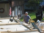 "Commode-ore" Catoe looking over progress before workday, Aug 9
