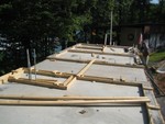 "Commode-ore" Catoe looking over progress before workday, Aug 9