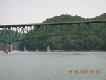 Boats pass under bridge for finish (picture by Mark Galloway)