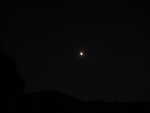 not quite a full moon, partly cloudy sky hurt visibility